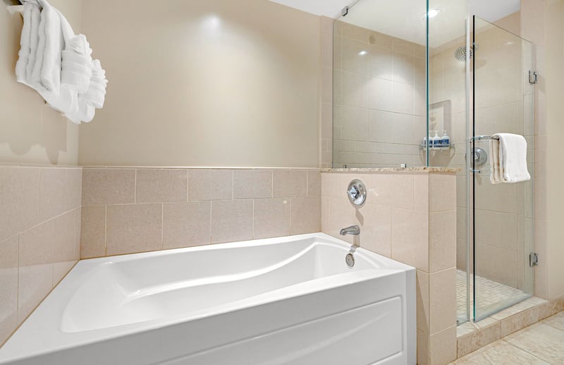 Spa-like bathroom retreat with soaking tub and sleek glass shower. HKK-820