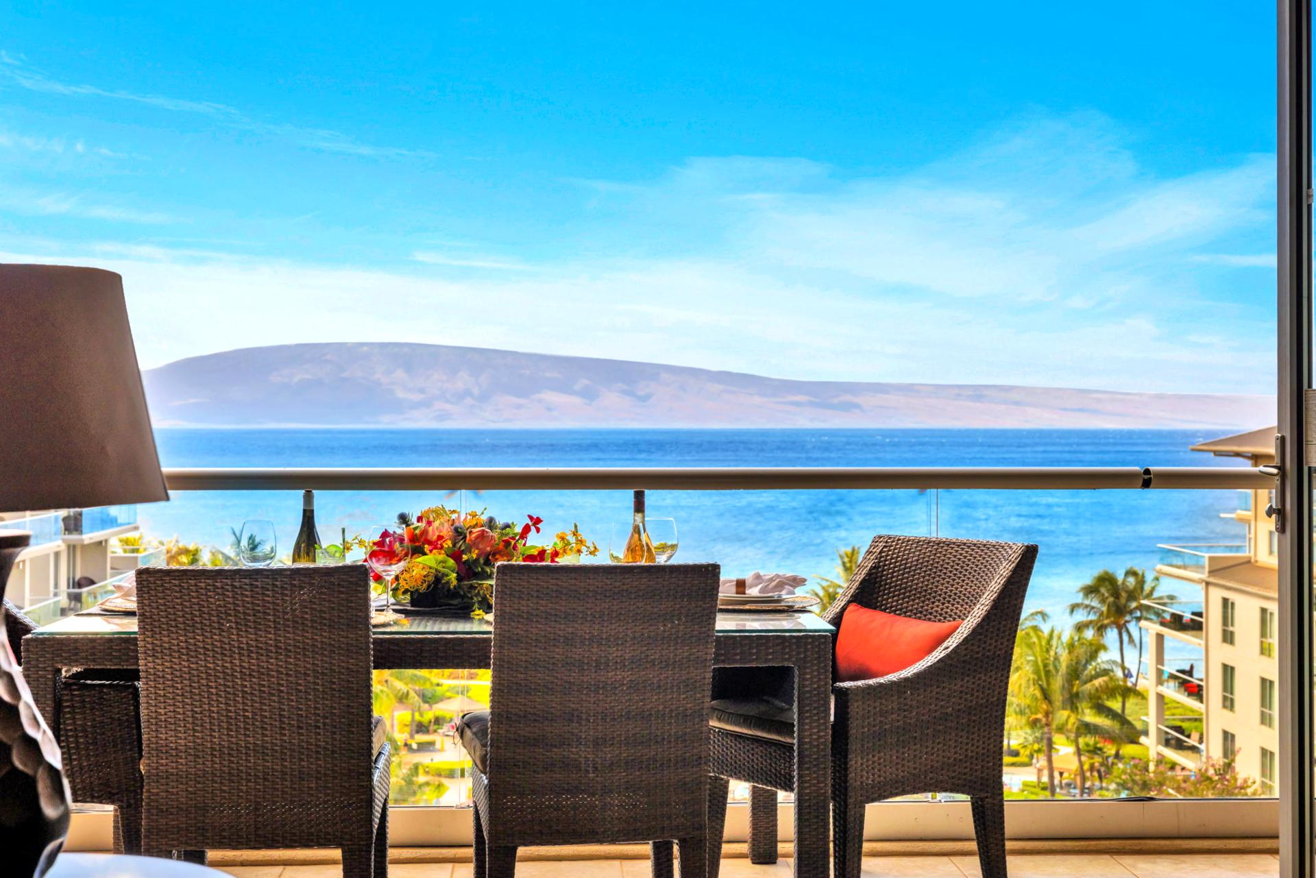 Ocean-view lanai with seating for four, ideal for morning coffee or sunset cocktails overlooking the Pacific.