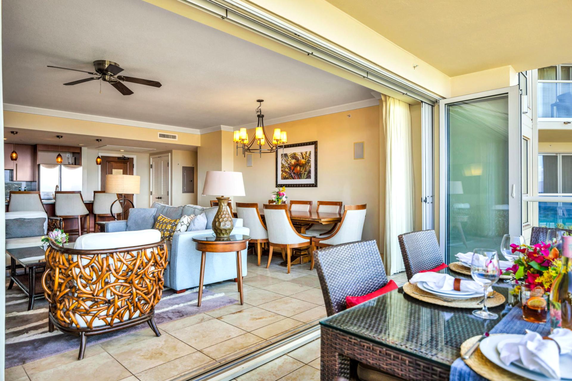 Indoor-outdoor flow from living to lanai with ocean and pool views just beyond.