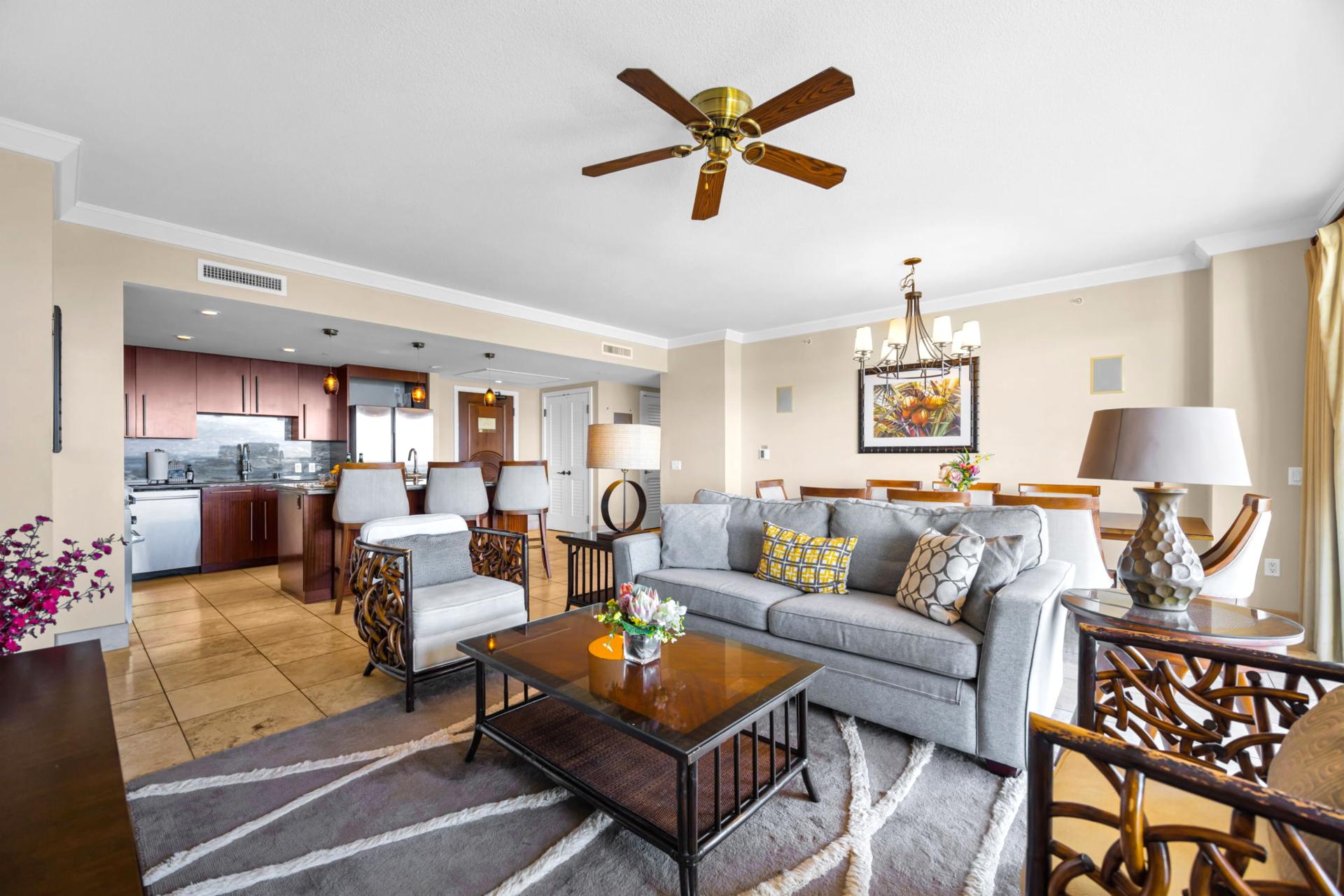 Spacious living area flows into dining, with warm tones and plenty of natural light.