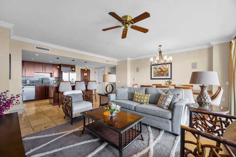 Spacious living area flows into dining, with warm tones and plenty of natural light.