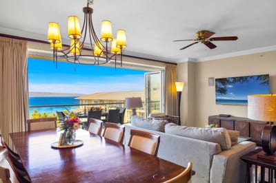 Dining table for six with ocean glimpses and elegant lighting for easy in-home meals. HKK-825