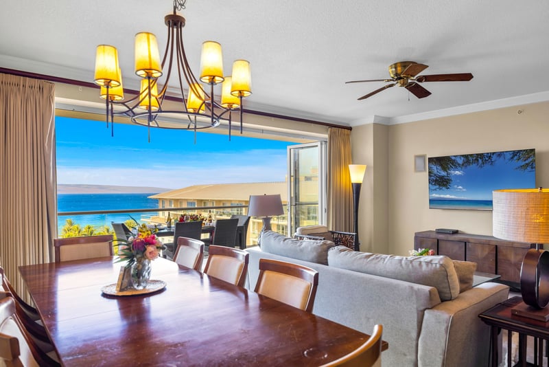 Dining table for six with ocean glimpses and elegant lighting for easy in-home meals.