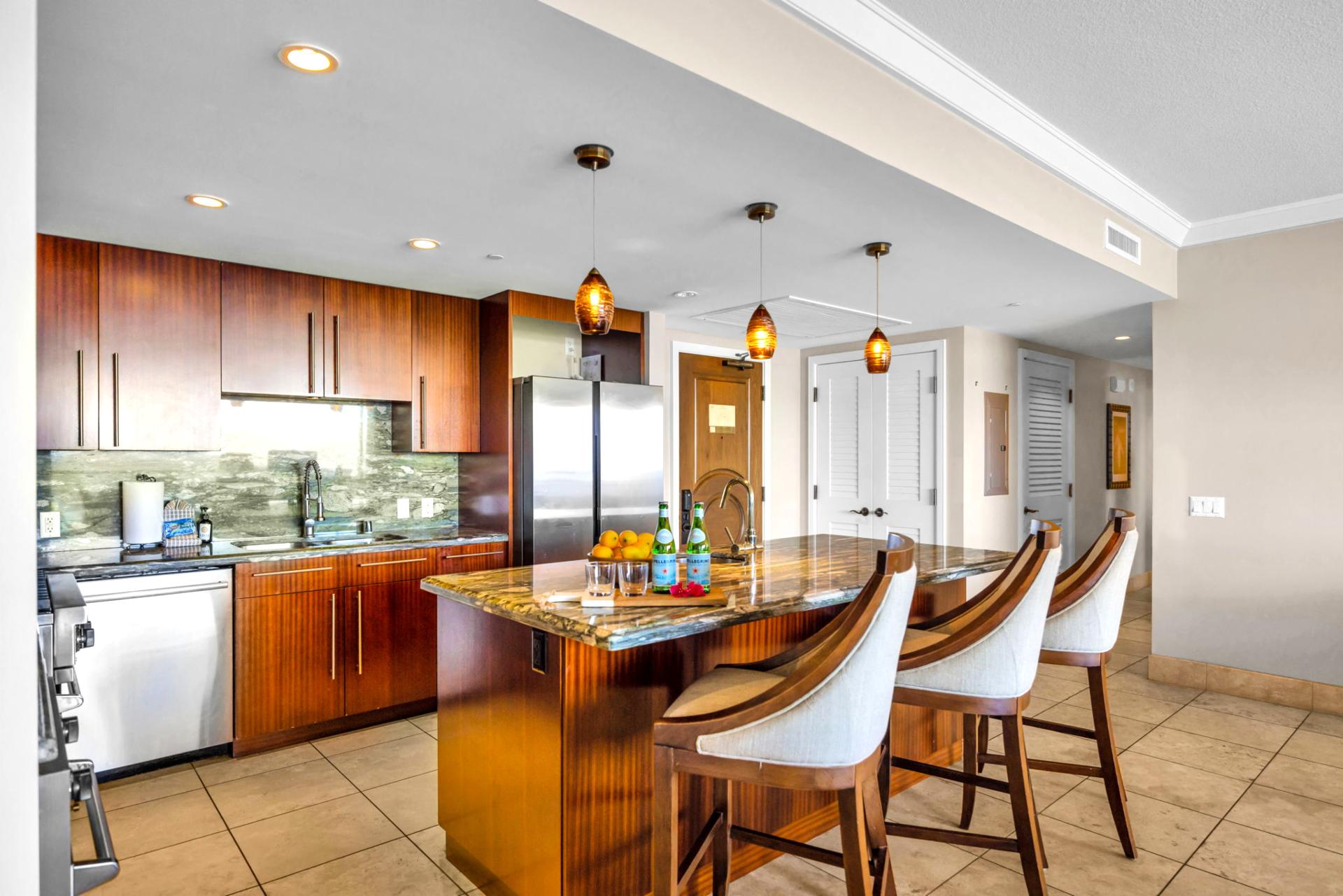 Gourmet kitchen with bar seating and top-tier appliances for effortless vacation meals.