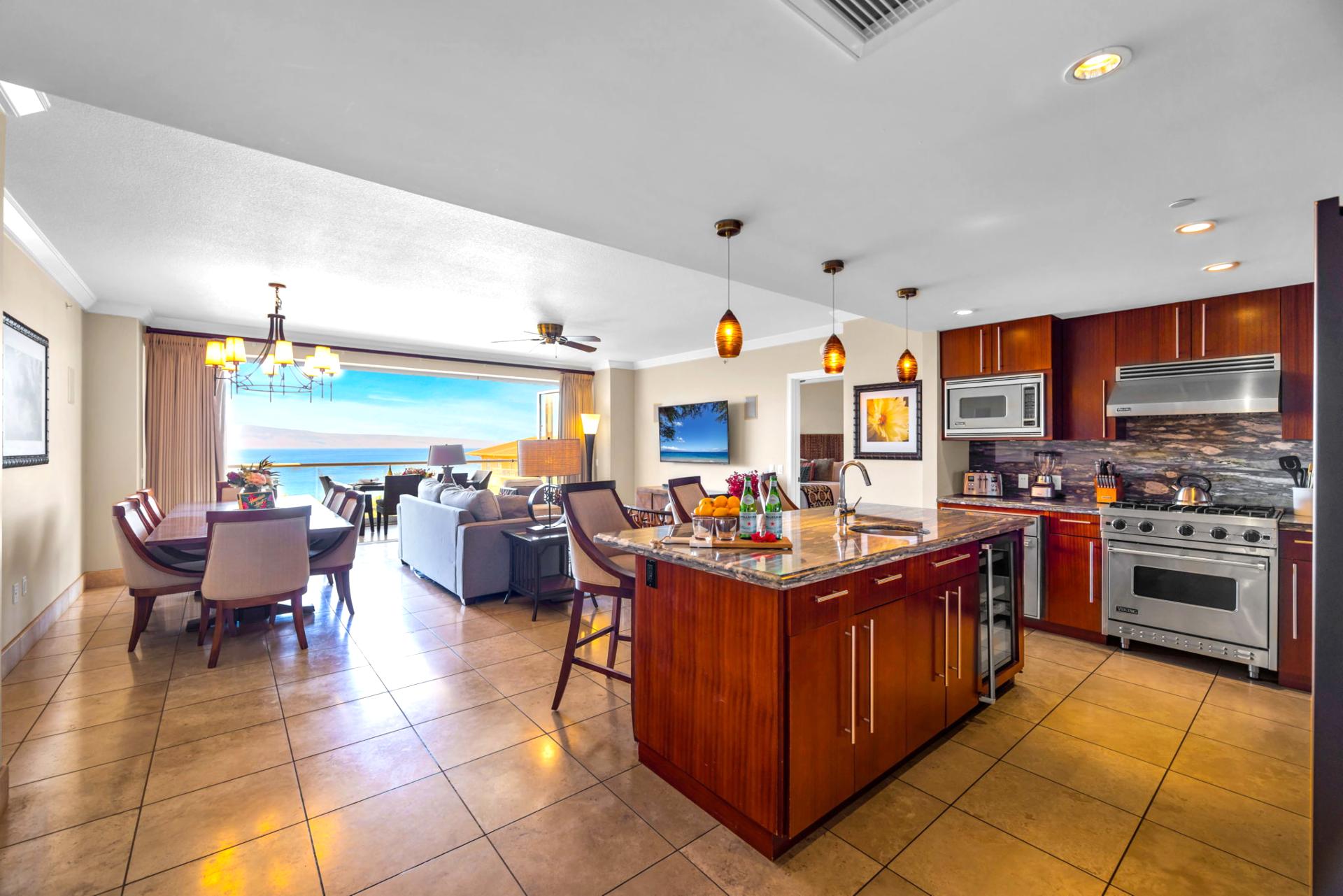 Well-appointed kitchen with wraparound counters, breakfast bar, and wood cabinetry.