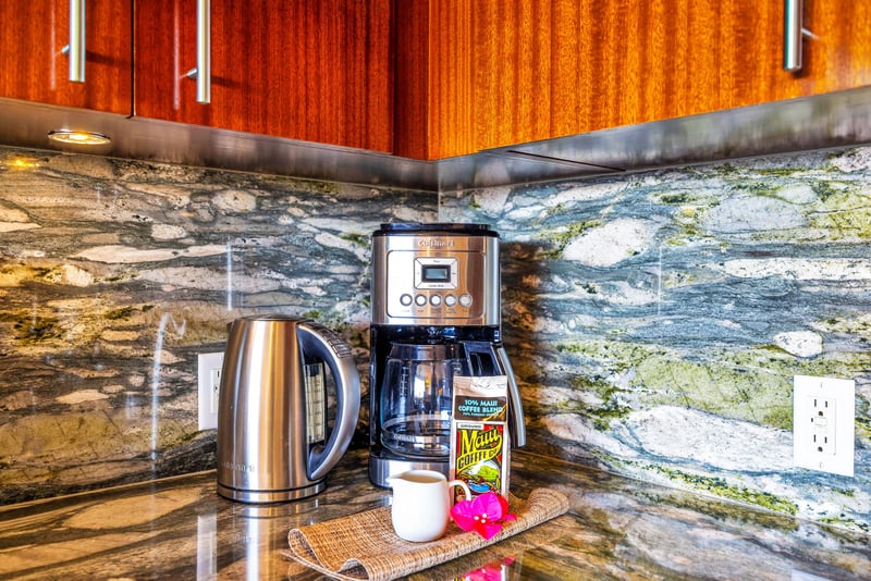 Coffee bar and granite counters highlight the fully equipped kitchen’s thoughtful layout.