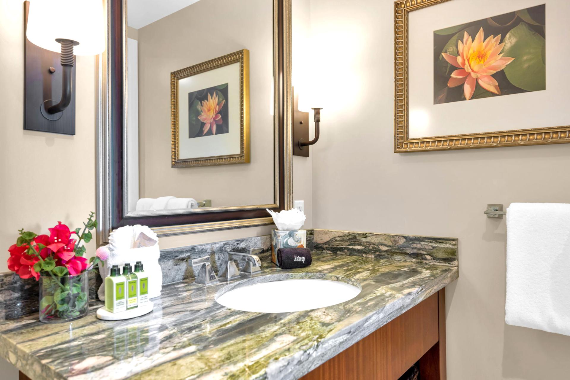 Granite vanity and accent lighting bring spa-inspired touches to the guest bath.