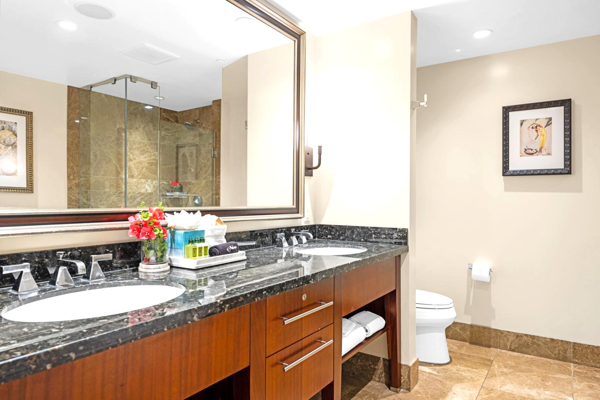 Ensuite bath with walk-in shower and granite counter for easy morning routines.