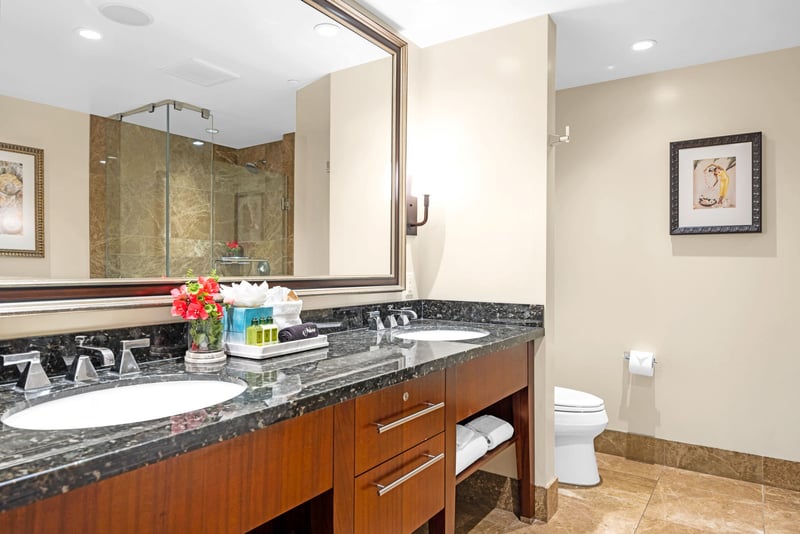 Ensuite bath with walk-in shower and granite counter for easy morning routines.