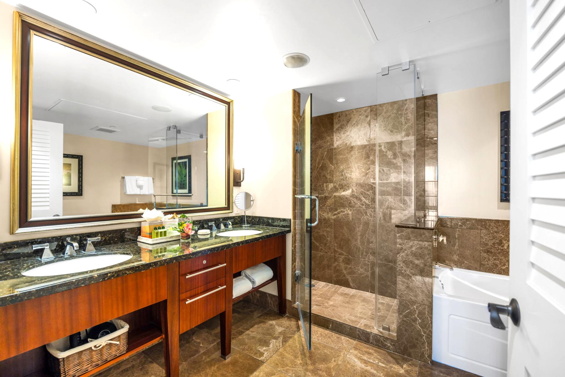 Guest bathroom with granite counters and walk-in shower for convenience.