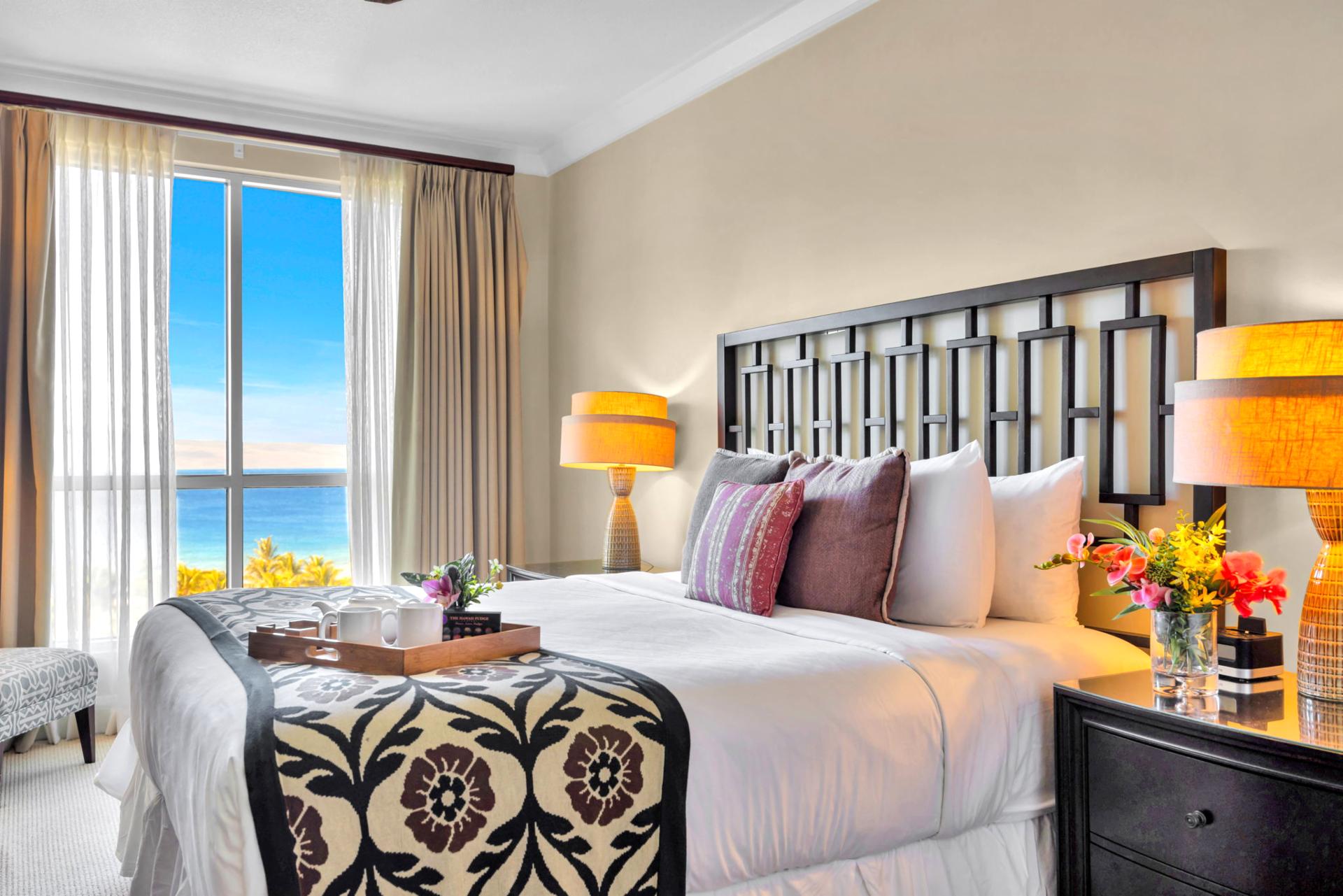 Serene King bedroom with neutral tones and warm lighting for restful nights.