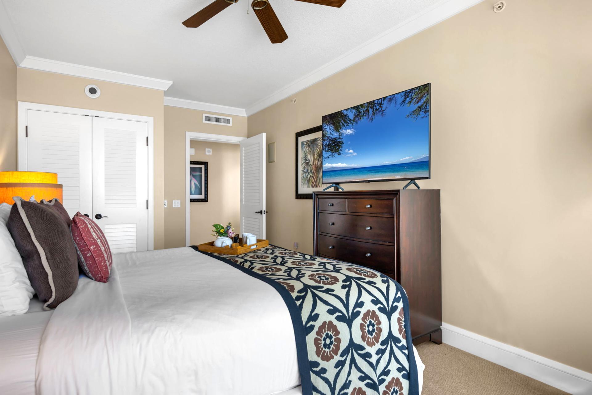King bed and mounted Smart TV make this primary suite perfect for movie nights.