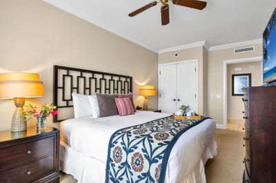 Spacious King bedroom with Smart TV and calming natural light. HKK-825