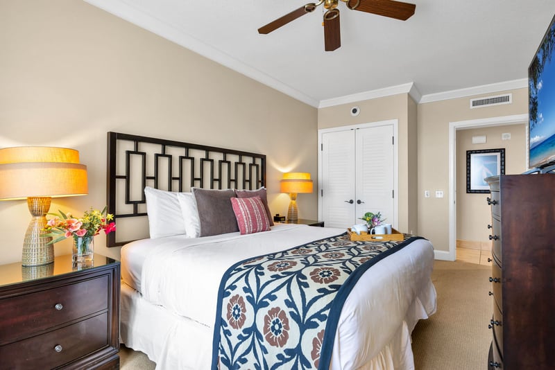 Spacious King bedroom with Smart TV and calming natural light.