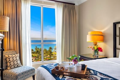 King primary suite with ocean glimpses and ensuite access for added comfort. HKK-825