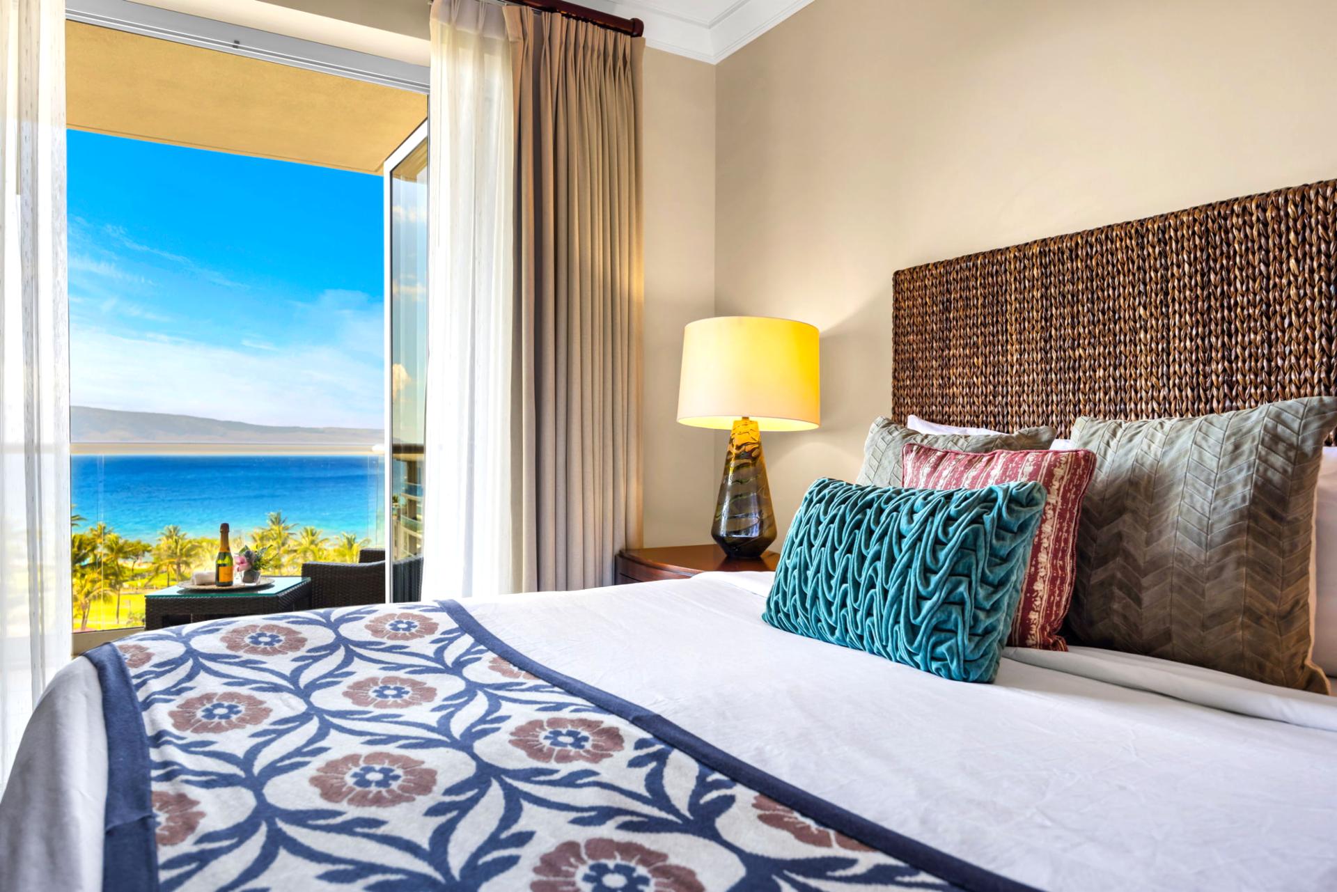 Large guest bedroom with King bed, Smart TV, and full ocean view.