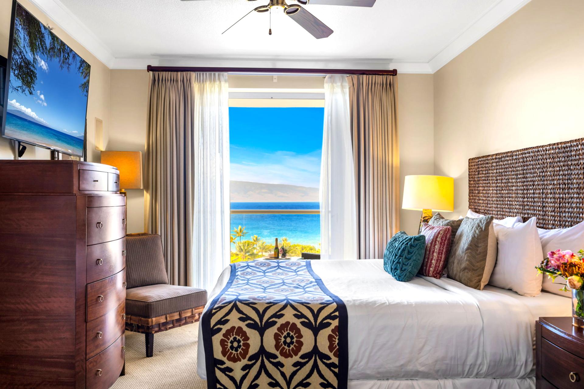 Guest room with King bed, Smart TV, and view-filled windows for a peaceful retreat.