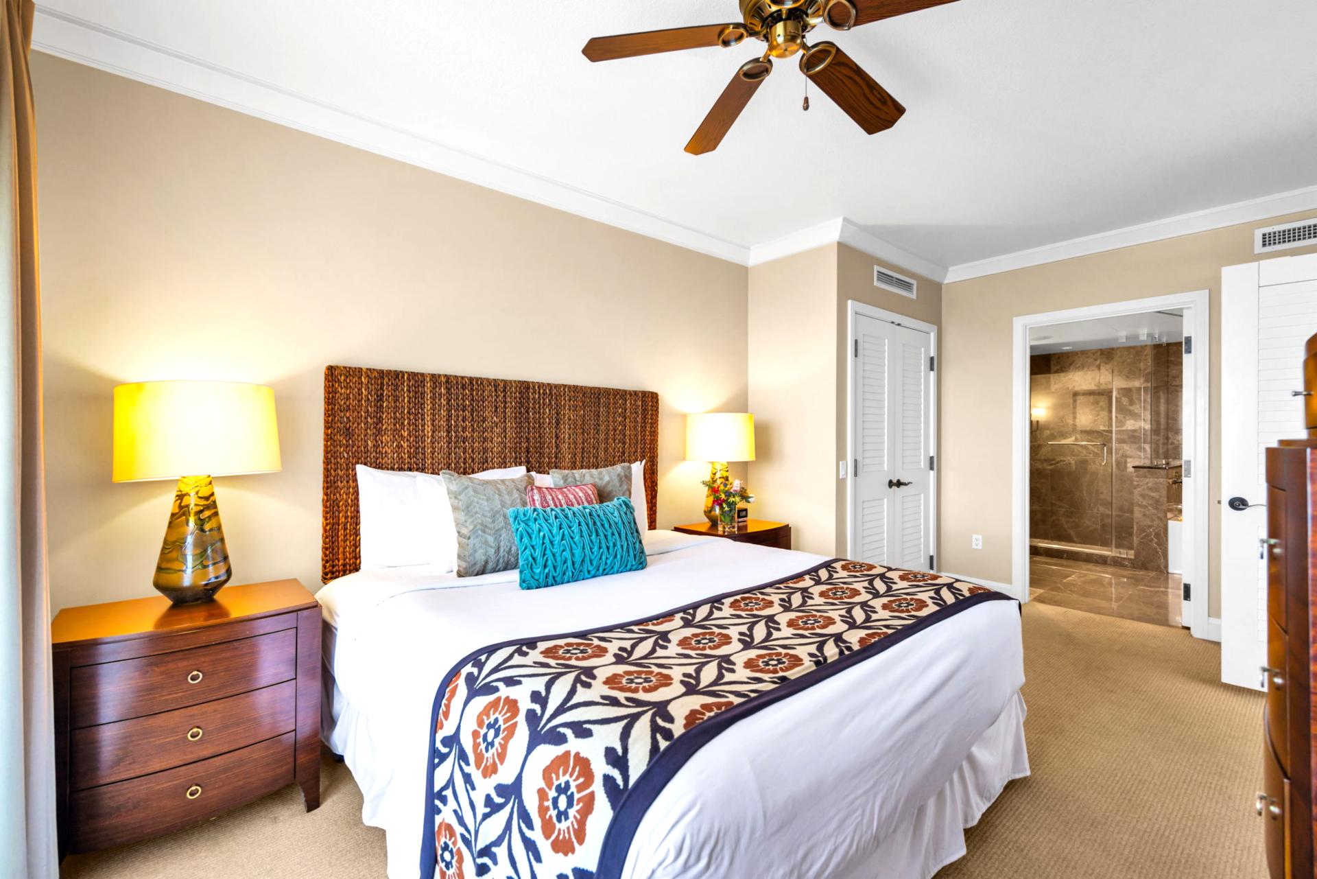 Guest bedroom with King bed and ceiling fan, ideal for a restful sleep.