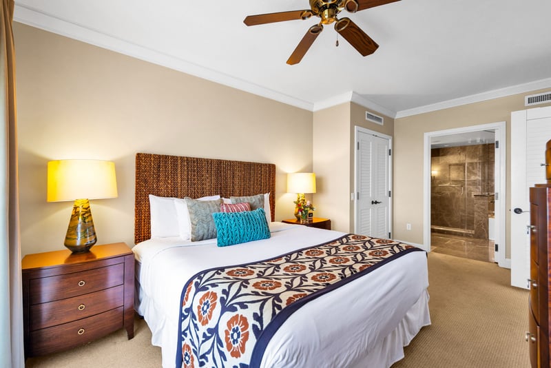 Guest bedroom with King bed and ceiling fan, ideal for a restful sleep.