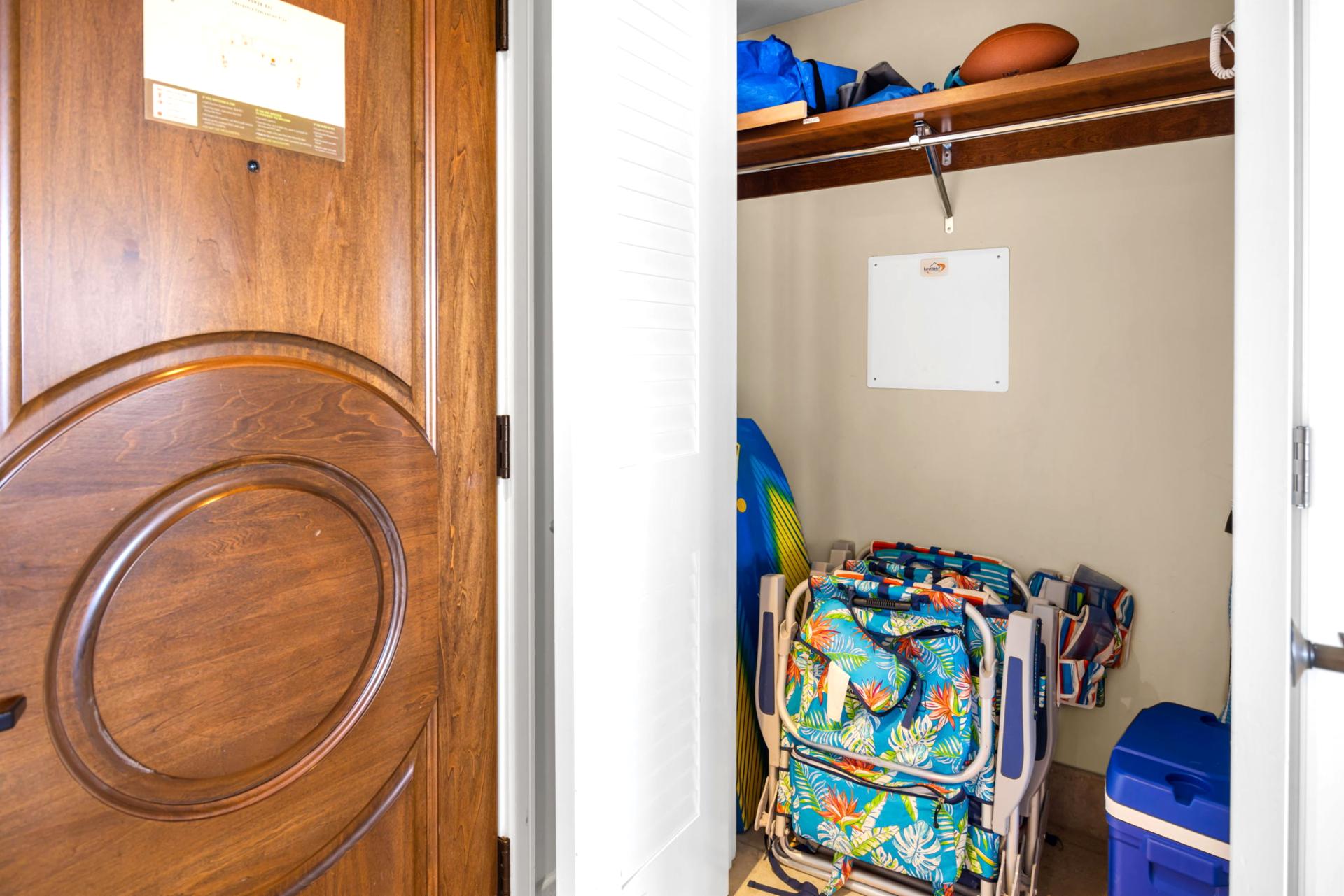 Entry nook with vibrant local art adds a welcoming touch of island style.
