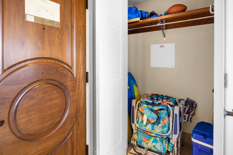 Entry nook with vibrant local art adds a welcoming touch of island style.