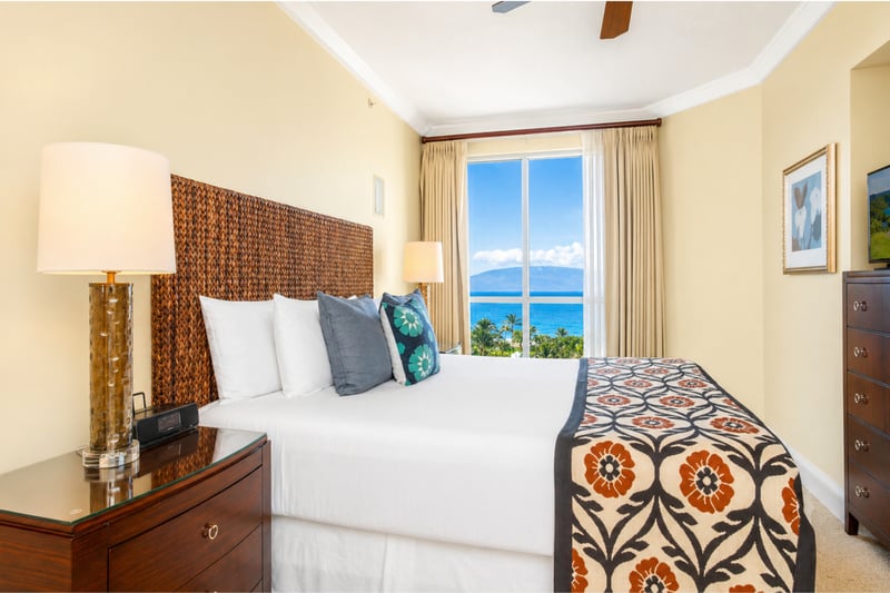 Guest bedroom offers comfortable bedding and tasteful decor, creating a welcoming space for additional guests.
