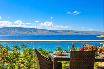 Bright blue skies and sweeping ocean vistas frame your elevated balcony, a perfect spot for morning coffee with fresh island air.