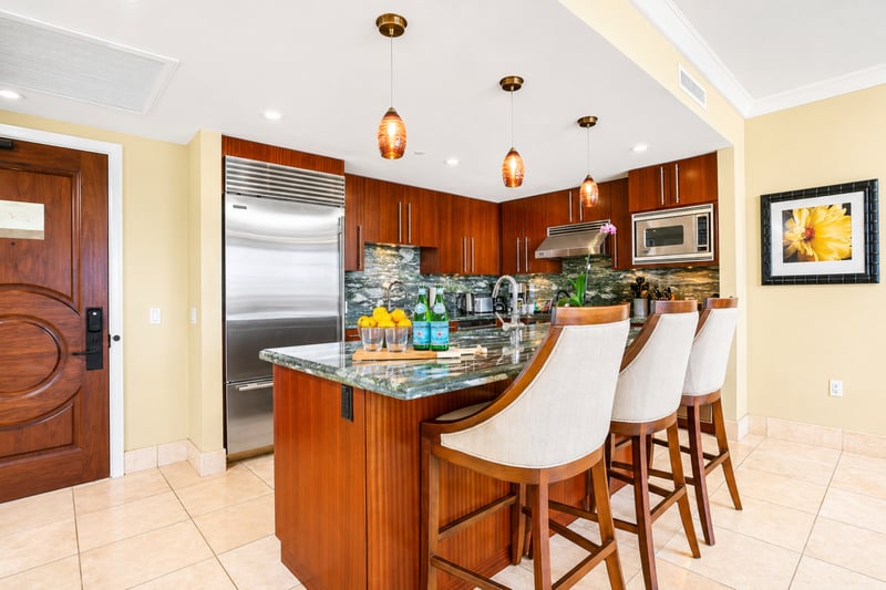 Granite countertops and bar seating make your kitchen both functional and social, ideal for casual breakfasts or evening drinks.