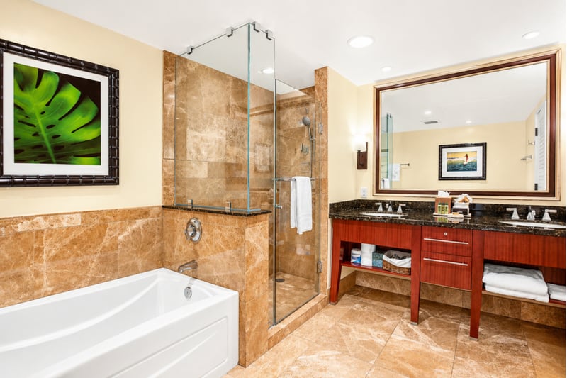 Another guest bath includes a shower and vanity with generous counter space, making it easy for everyone to get ready.