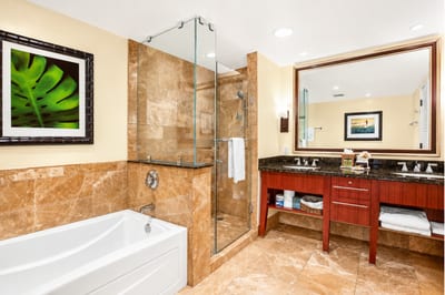 Another guest bath includes a shower and vanity with generous counter space, making it easy for everyone to get ready.