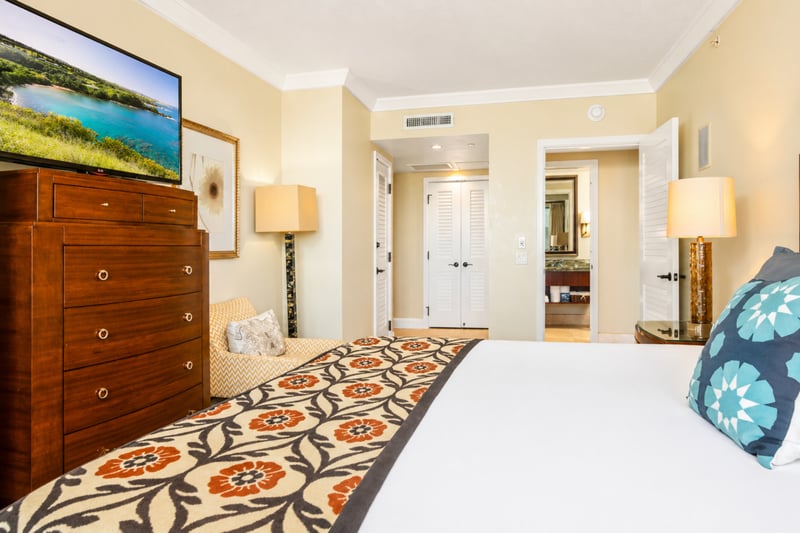 Alternate view of the guest bedroom shows ample space and easy access to nearby bathroom amenities.
