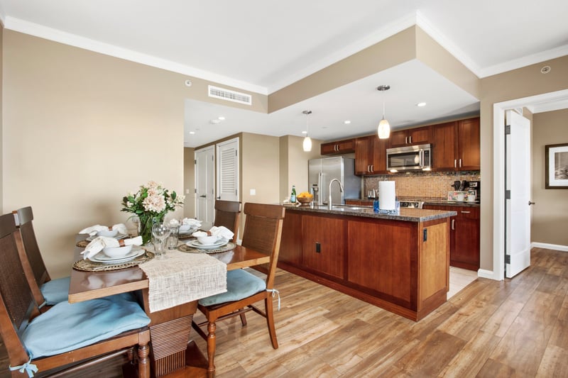 Modern kitchen and dining area with elegant wood and lighting. HKK-920