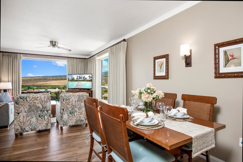 Chic dining setup with floral centerpiece and scenic living views. HKK-920