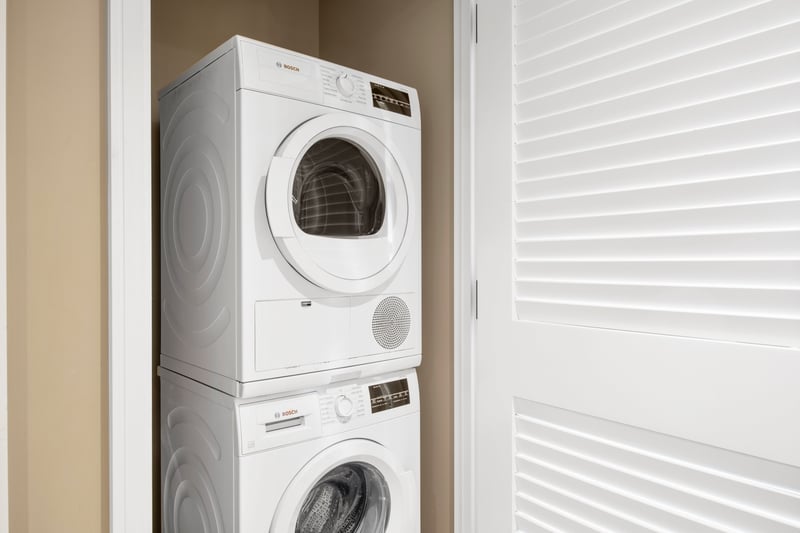 In-suite Bosch washer and dryer for convenient guest laundry needs. HKK-920