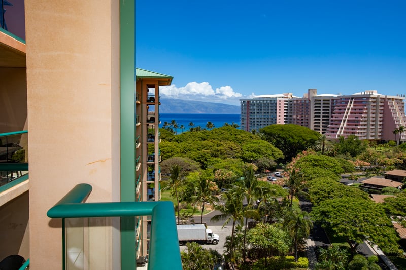 Private lanai with lush garden views and sparkling ocean backdrop. HKK-920