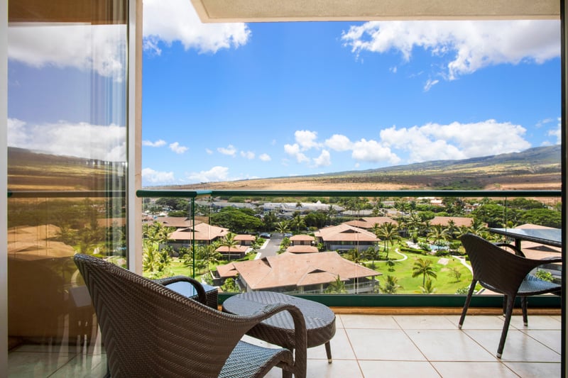 Relaxing balcony chairs with tropical garden and mountain ridge views. HKK-920