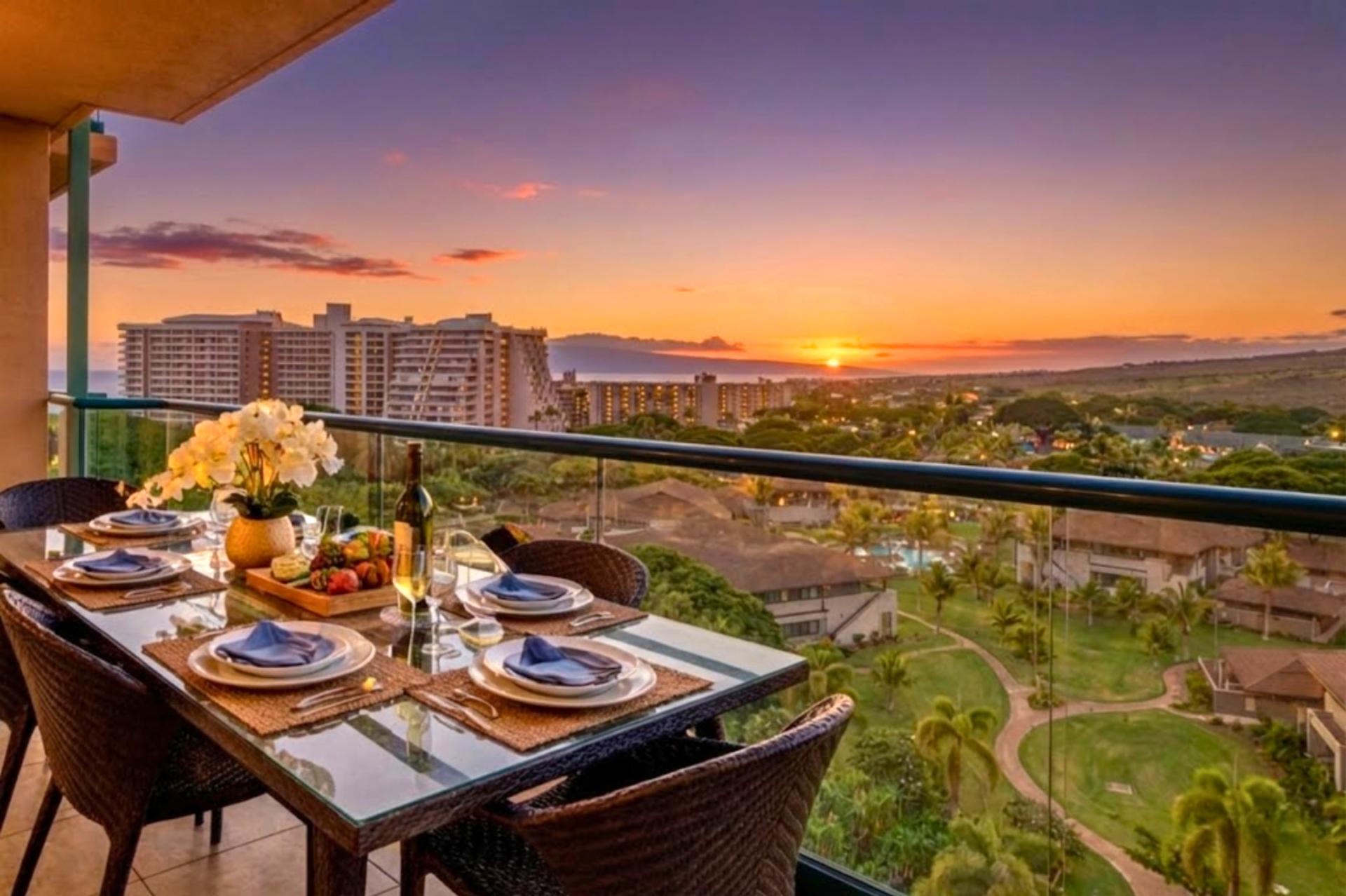 Dine outdoors as the sky glows at sunset, with Maui Mountain scenery and partial ocean views creating a memorable backdrop for evening meals.