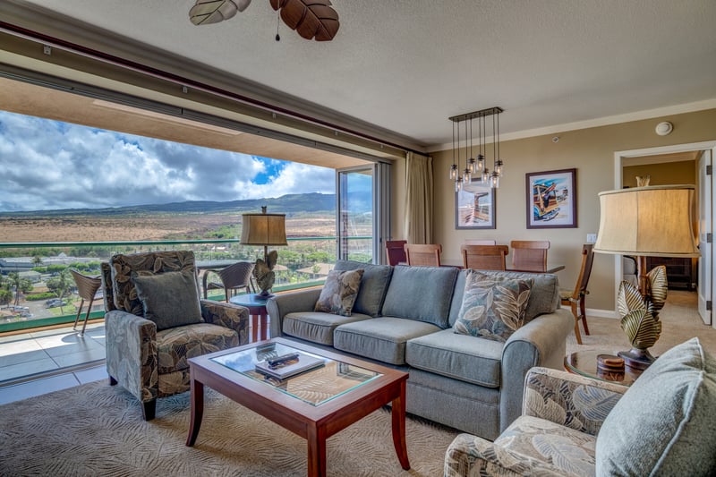 Spacious island-style living room with stunning panoramic mountain view.