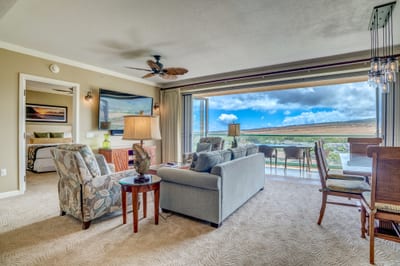 Open-concept luxury living with seamless indoor-outdoor island views.