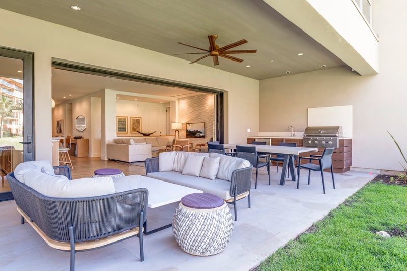 Indoor-outdoor living with lounge, dining, and barbecue area for airy mornings and cozy nights 