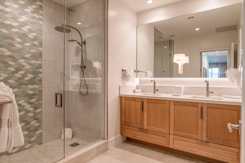 Modern bathroom with dual sinks and convenient walk in shower