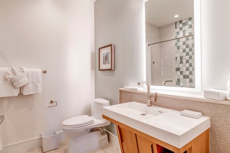 Modern upgraded bathroom with new back lit vanity