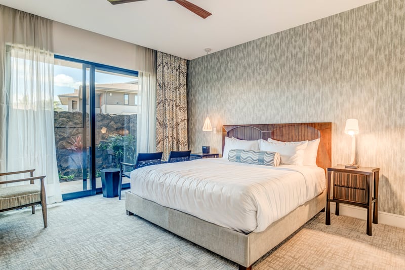 Spacious master bed with lanai access and relaxing tones for a restful nights sleep
