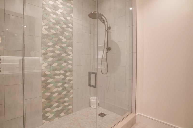 Walk-in glass shower with spa-inspired rainfall shower head