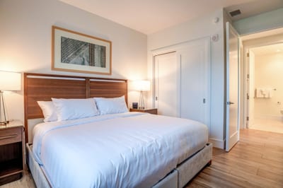 Modern guest suite with plush bedding for restful nights or island naps