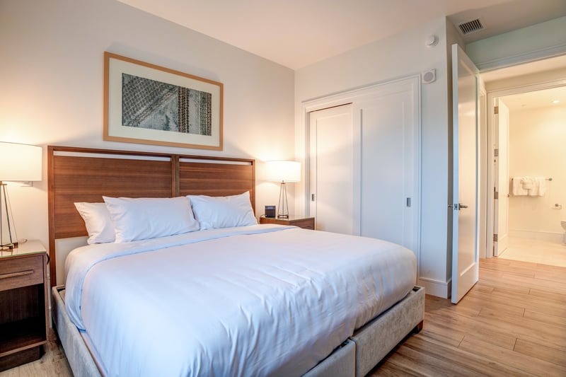 Modern guest suite with plush bedding for restful nights or island naps