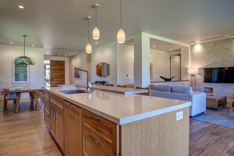 Luxury kitchen design featuring quartz countertops, stainless appliances, and wood finish cabinets