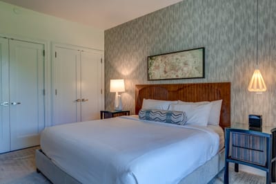 Elegant master bedroom retreat with king bed, double closet and modern lighting for a peaceful stay