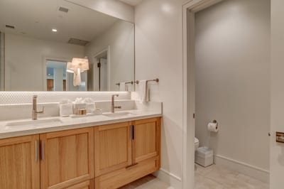Spacious bathroom with dual vanities, quartz countertops, and plenty of space for your morning routine