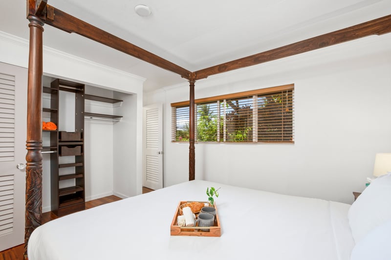Rustic island textures meet elegant simplicity in this cozy suite, where dreams float on a breezy tropical breeze